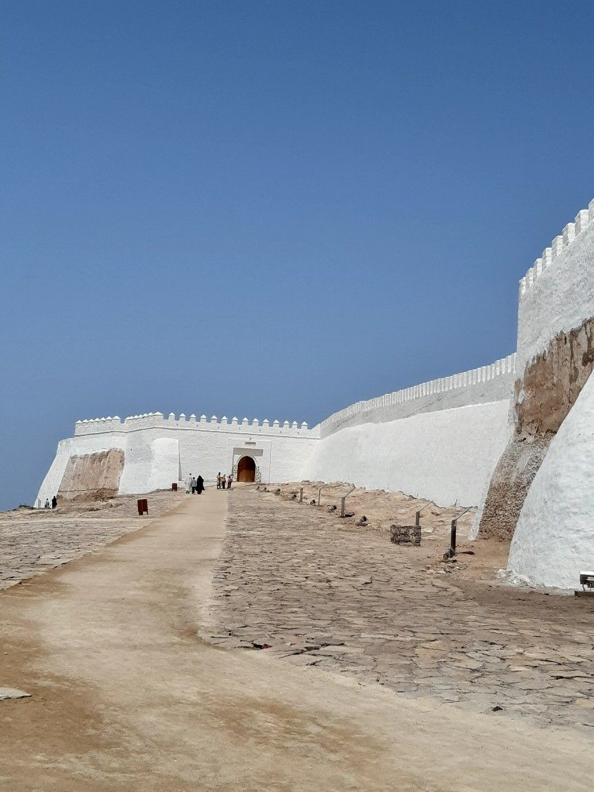 Agadir Oufella Kasbah cobblestone path gate white walls Morocco