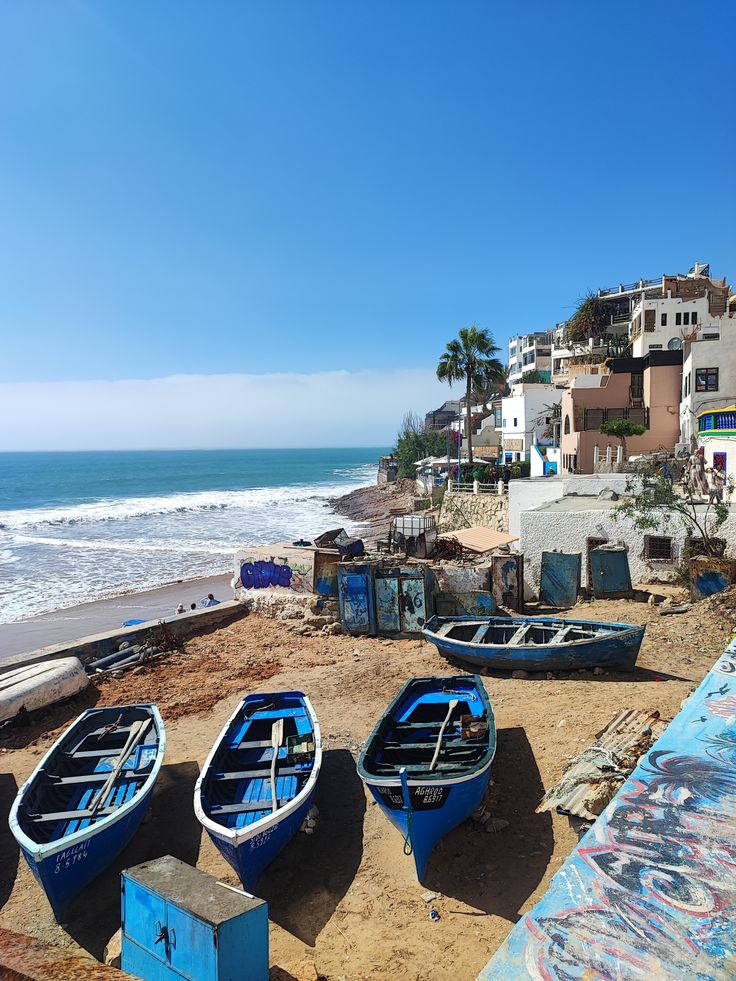 Taghazout village blue fishing boats Morocco surf