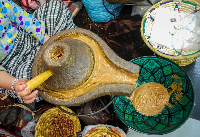 argan oil stone mill traditional grinding Morocco women cooperative